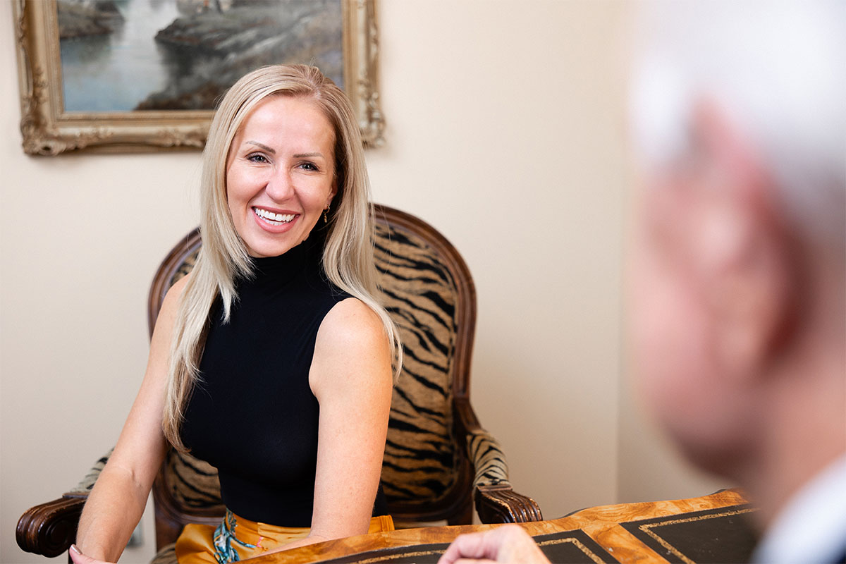 woman smiling during consultation for rhinoplasty in Gulf Shores, AL